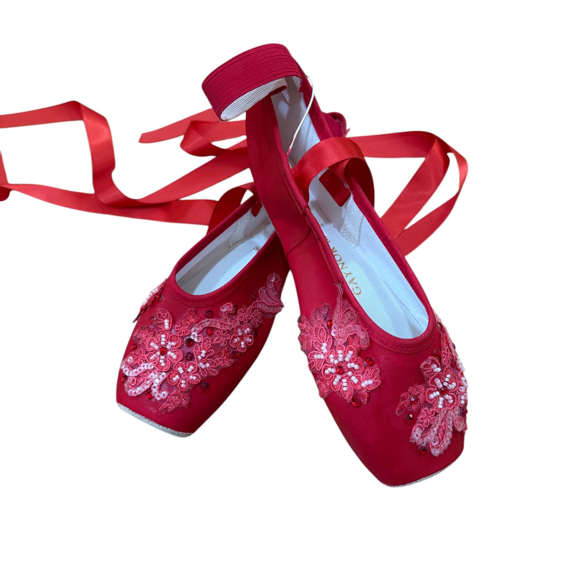 Red embellished pointe shoes